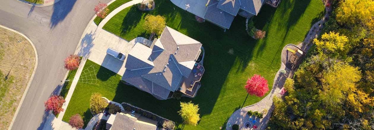 Aerial view of suburban residential properties showing property boundaries, driveways, and shared access areas typical of easement arrangements in New Zealand.
