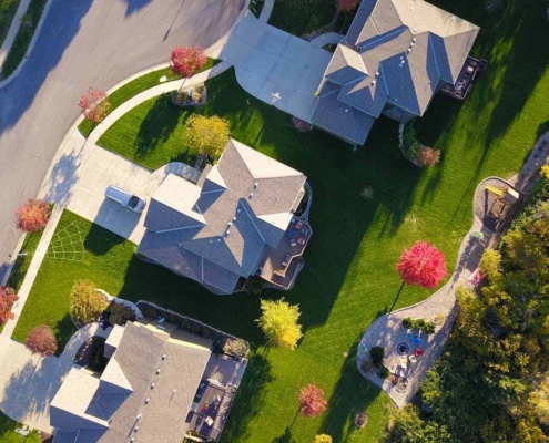 Aerial view of suburban residential properties showing property boundaries, driveways, and shared access areas typical of easement arrangements in New Zealand.