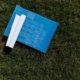 Building plans laid on grass for a property survey and site development assessment