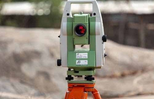 Surveying total station used for settlement and deformation monitoring on a construction site