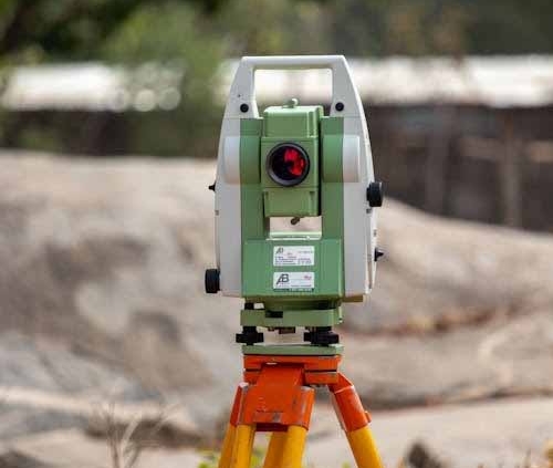 Surveying total station used for settlement and deformation monitoring on a construction site