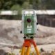 Surveying total station used for settlement and deformation monitoring on a construction site
