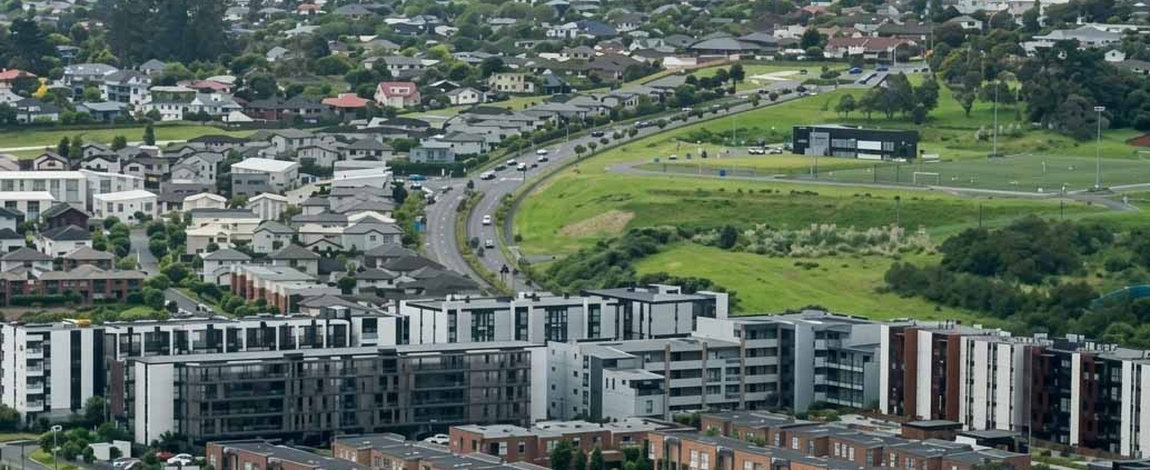 Aerial view of an Auckland suburb with houses on individual residential sections