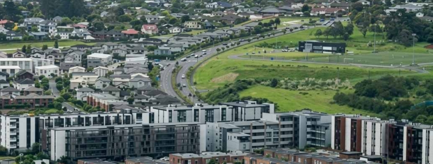 Aerial view of an Auckland suburb with houses on individual residential sections